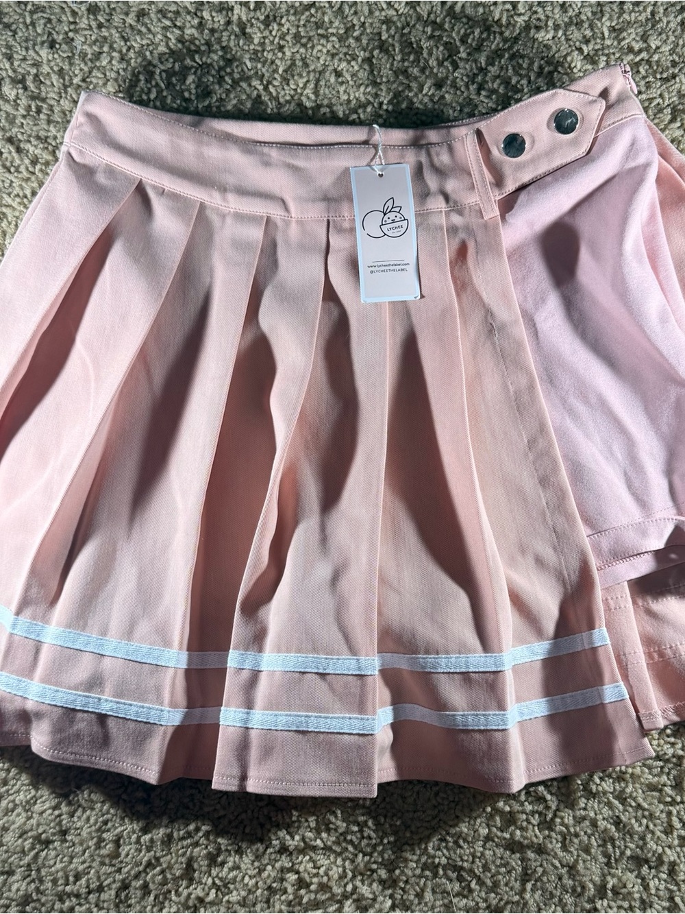 Adorable pleated skirt with shorts underneath and buckle at the thigh, brand new